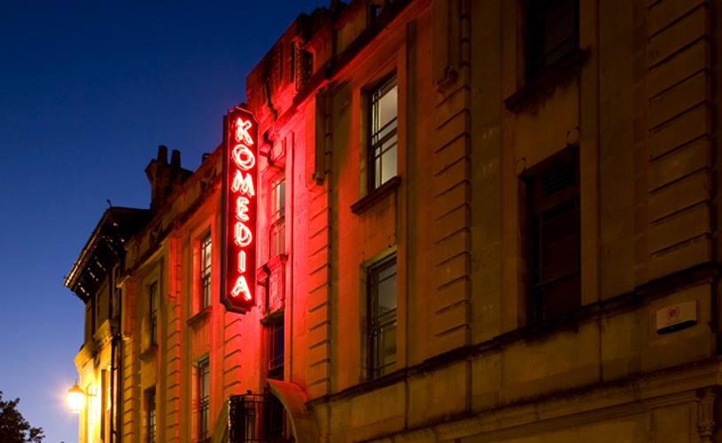 Neon Komedia sign in Bath